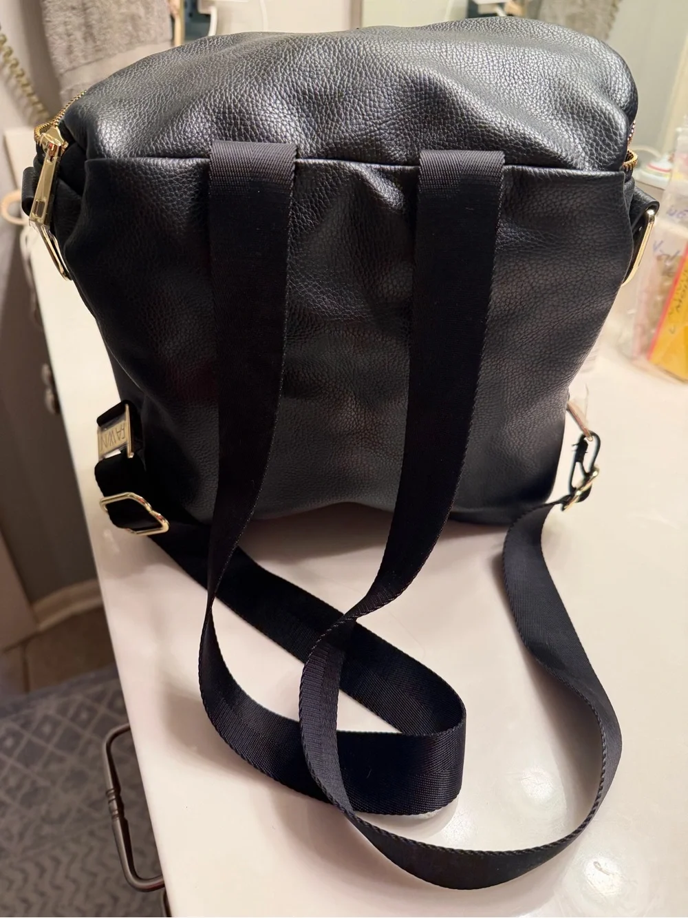 FAWN DESIGN Black Pebbled Leather Crossbody Backpack with Gold Hardware
